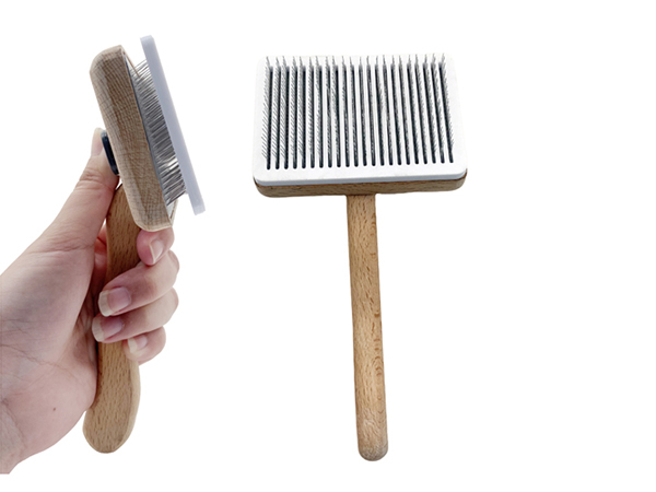 Wooden self-cleaning pet brush